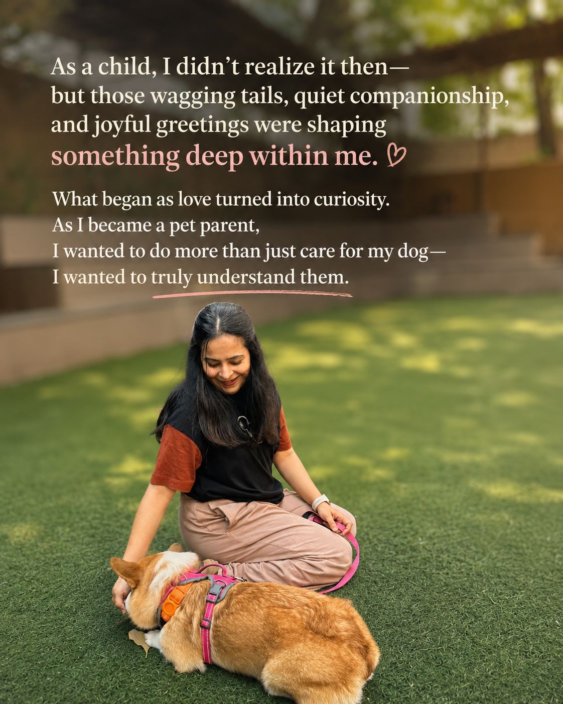Payal sitting on grass with a corgi